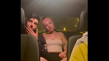 Amateur couple gets intimate in a taxi after a party, captured by hidden camera