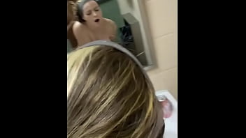 Long-haired blonde enjoys dirty talk during public bathroom encounter