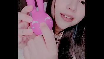 A girl explores her sexuality with a bunny toy in a solo session